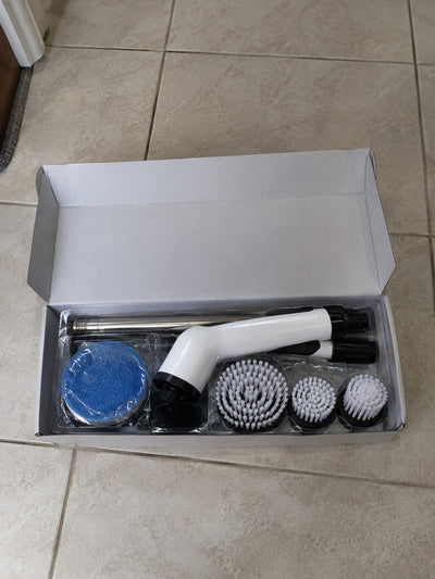 La caja abierta con el cepillo y sus accesorios
